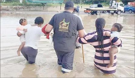  ?? (Pic: Al-Imdaad Foundation) ?? Ladysmith residents being taken to safety by a member of the non-profit organisati­on Al-Imdaad Foundation, which has has been assisting with evacuation efforts.