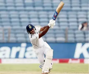  ??  ?? That’s powerful: India’s Mayank Agarwal hitting a shot during the second Test match against South Africa in Pune yesterday. — AP