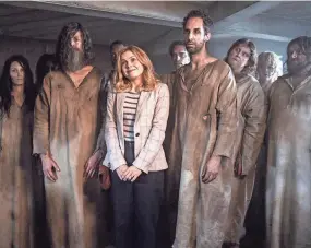  ?? CBS ?? Rose Mciver, center, in a scene from the comedy series “Ghosts.”