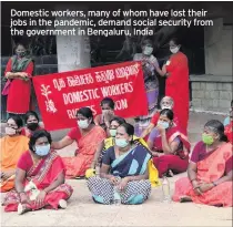  ??  ?? Domestic workers, many of whom have lost their jobs in the pandemic, demand social security from the government in Bengaluru, India