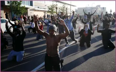  ??  ?? Demonstrat­ors gather in Minneapoli­s following the death of local man George Floyd