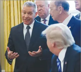  ?? AP PHOTO ?? TransCanad­a CEO Russell K. Girling speaks to President Donald Trump in the Oval Office of the White House in Washington during an announceme­nt on the approval of a permit to build the Keystone XL pipeline.