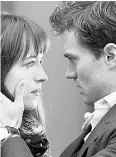  ?? Universal Pict ures / Focus
Feat ures / The Associat ed Press ?? Dakota Johnson and Jamie Dornan star in “Fifty Shades of Grey,” based on the erotic novel
of the same name.