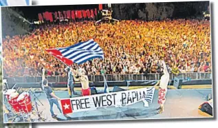  ?? Picture: https://www.humanright­s.gov.au ?? Several thousand people put their fists in the air showing support for the 2012 Free West Papua campaign.