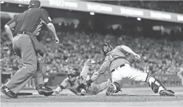  ?? FRANCISCO. NEVILLE E. GUARD/USA TODAY SPORTS ?? The D-Backs’ Daniel Descalso (3) is tagged out at home plate by Giants catcher Nick Hundley during the second inning at AT&T Park on Friday night in San