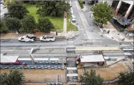  ?? RICARDO B. BRAZZIELL / AMERICAN-STATESMAN ?? The existing rail station site would become a pedestrian plaza, and the two blocks of Fourth between Trinity and Red River streets would be closed to cars. A portion of Fifth Street has been converted to two-way traffic.