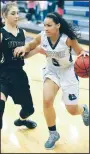  ?? NWA Democrat-Gazette/ANDY SHUPE ?? Ashley Breathitt (right) of Fayettevil­le drives to the basket as Krista Clark of Bentonvill­e defends Jan. 14 during the first half in Bulldog Arena.