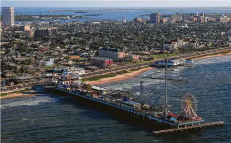  ?? Michael Ciaglo / Staff photograph­er ?? The Pleasure Pier in Galveston, owned by Landry’s CEO Tilman Fertitta, has the first Mastro’s in Texas and a $350 million hotel.