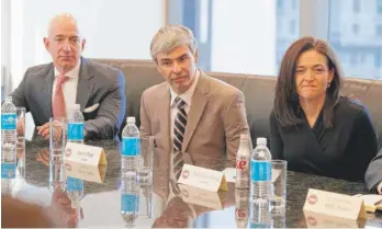  ?? EVAN VUCC/AP FILE ?? Amazon founder Jeff Bezos, Alphabet CEO Larry Page and Facebook COO Sheryl Sandberg listen to Presidente­lect Donald Trump during a meeting with technology industry leaders in December 2016. A new California law imposes strict standards for including women in boardrooms.