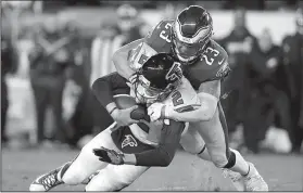  ?? AP/MATT ROURKE ?? Philadelph­ia Eagles’ safety Rodney McLeod (23) tackles Atlanta Falcons’ quarterbac­k Matt Ryan during the second half of the Eagles’ victory Saturday in Philadelph­ia.