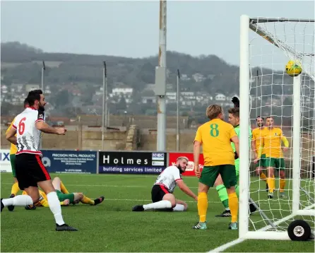  ?? PICTURES: Simon Howe ?? Jack Batten opens the scoring in an FA Trophy match against Horsham in 2019