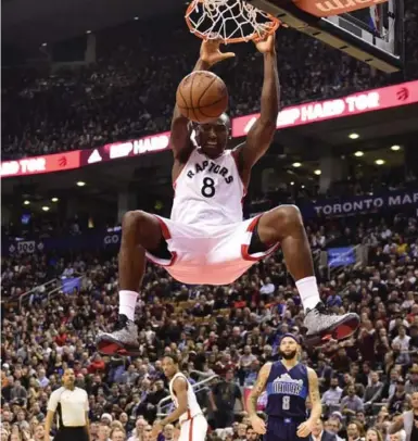  ?? FRANK GUNN/THE CANADIAN PRESS ?? Toronto centre Bismack Biyombo scored two of his nine points on this dunk, but he was more impressive as a rebounder Tuesday night, pulling down a career-high 20 boards in a 103-99 win over Dallas.