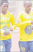  ?? (Pics: Ntokozo Magongo) ?? Denver Sundowns’ player Kwanele Dlamini (R) celebrates after they scored a goal while followed by Reagan Charles and Mike Dombo on Sunday during the MoMo Cup. (R) Denver Sundowns players Sibusiso Manana (L) and Mthokozisi Hlatshwako leave the field while wearing Mamelodi Sundowns official shirts and Denver Sundowns shorts during the MoMo Cup at Mavuso Sports Centre on Sunday.