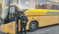  ?? PICTURES: PIERRE CROM/GETTY IMAGES ?? FLEEING: Above, Niall Gordon with the bus he drove to help people evacuate Ukraine. Top, civilians attempt to flee Kyiv, in February.