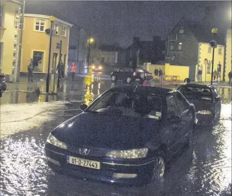  ??  ?? There were scenes of heavy rainfall on the streets of Arklow after the torrential downpours during the past week.