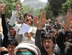  ??  ?? KABUL: Afghans chant slogans during a demonstrat­ion in Kabul, Afghanista­n, yesterday. More than 200 male students protested in front of Kabul University yesterday against a decree, which includes a ban on child marriage and forced marriage, making...