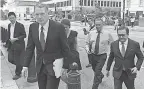  ?? AP ?? U.S. Trade Representa­tive Robert Lighthizer, front left, and Mexican Secretary of Economy Idelfonso Guajardo, front right, walk to the White House on Monday.