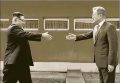  ?? AP ?? North Korean leader Kim Jongun (left) with South Korean President Moon Jaein, Panmunjom, Demilitari­zed Zone, April 27, 2018