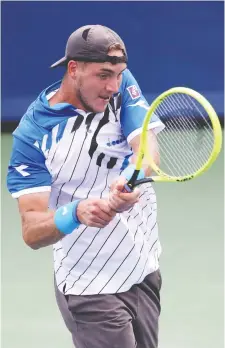  ?? ROB CARR/GETTY IMAGES ?? Germany’s Jan-Lennard Struff got the best of Stefanos Tsitsipas during Day 5 of the Cincinnati Masters event, downing the young Greek in a closely contested match, 6-4, 6-7 (5), 7-6 (6).
