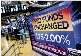  ?? RICHARD DREW / ASSOCIATED PRESS ?? A screen at the New York Stock Exchange displays the Federal Reserve’s decision Wednesday to leave interest rates unchanged. The Fed said the U.S. economy is “strong” and signaled that more rate hikes are coming.