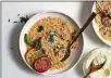  ?? FOOD STYLED BY IAH PINKNEY; ANDREW SCRIVANI/THE NEW YORK TIMES ?? Tomato risotto, served with a few slices of heirloom tomatoes, is equally at home as a side or a main dish in New York on July 29.