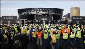  ?? STEVE MARCUS — LAS VEGAS SUN VIA AP ?? Las Vegas Raiders owner Mark Davis, center, speaks Wednesday during a news conference, officially renaming the team.