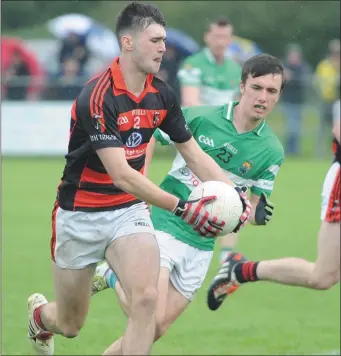  ??  ?? Aidan Browne on the attack for Newmarket against Macroom in the County IFC quarter final at Dromtariff­e Photo by John Tarrant