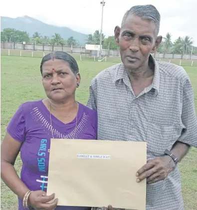  ?? Photo: Afa Kaumaitoto­ya ?? Ram Datt with his wife Bimla Wati at Subrail Park in Labasa holding their approval notice and 99-year lease on October 26, 2017.