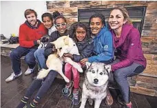  ?? TOM TINGLE/ARIZONA REPUBLIC ?? Sara and Ryan Hall in 2015 adopted four Ethiopian sisters, from left, Jasmine, Mia, Lily and Hana.