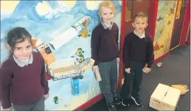  ?? ?? Áine, Ella and Johnny with their marble run using ramps and drops.