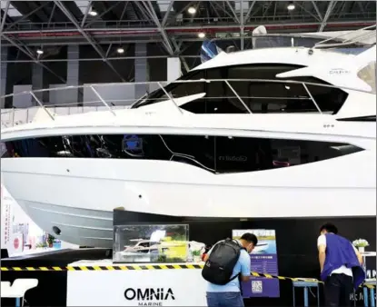  ?? ZHANG WEI / CHINA DAILY ?? A yacht is seen among countless product displays at the China Internatio­nal Consumer Products Expo in Haikou, Hainan province, on May 7.