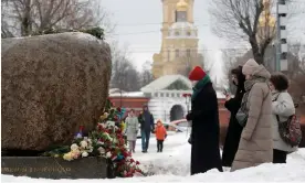  ?? Photograph: Anatoly Maltsev/EPA ?? Vigils were held across Russia after Alexei Navalny’s death in custody, including tributes paid to him near the memorial for political prisoners in St Petersburg.