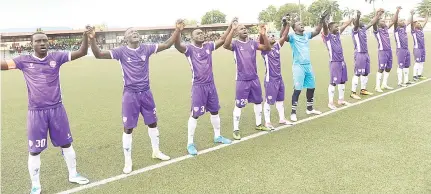  ?? — AFP photo ?? The players of Mountain of Fire and Miracles Ministries football club raise hand to pray before a continenta­l match at Agege Stadium in Lagos in this April 8 file photo.