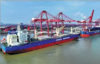  ?? JI HAIXIN / FOR CHINA DAILY ?? A COSCO vessel docks at Taicang Port, Jiangsu province.