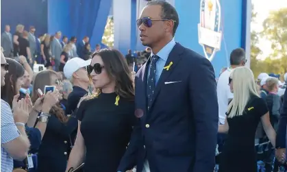  ?? Photograph: Tom Jenkins/The Guardian ?? Tiger Woods and Erica Herman at the Ryder Cup in 2018.