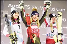  ??  ?? United States’ Mikaela Shiffrin (center), winner of an alpine ski women’s slalom celebrates with second-placed Switzerlan­d’s Wendy Holdener (left), and third-placed Austria’s Katharina Truppe in Levi, Finland on Nov 23.
(AP)