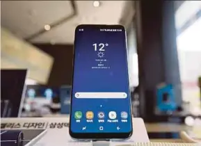  ?? BLOOMBERG PIC ?? The new Samsung Galaxy S8+ smartphone comes with better security, better entertainm­ent capabiliti­es and an expanded screen size.