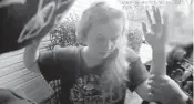  ?? COURTESY ?? Still frames from body camera footage of a Florida Department of Law Enforcemen­t raid of Rebekah Jones’ home.