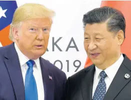  ?? AP ?? US President Donald Trump (left) poses for a photo with Chinese President Xi Jinping during a meeting on the sidelines of the G-20 summit in Osaka, western Japan, in June.