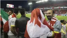  ?? CHRIS YOUNG/THE CANADIAN PRESS ?? Syrian refugees gather to watch Toronto FC Wednesday at BMO Field.