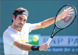  ??  ?? Roger Federer hits a backhand in his match against Filip Krajinovic.