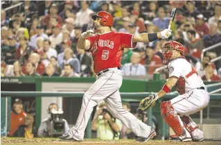  ?? TOMMY GILLIGAN/USA TODAY SPORTS ?? Los Angeles Angels slugger Albert Pujols hits a home run — the 500th of his career — during the fifth inning against the Washington Nationals at Nationals Park on Tuesday.