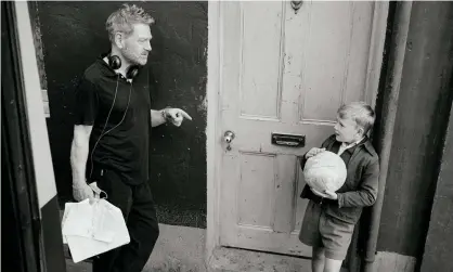  ??  ?? Kenneth Branagh directs Jude Hill, who plays a young Branagh, on the set of the film Belfast. Photograph: Rob Youngson/Focus Features
