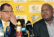  ?? Picture: SYDNEY MAHLANGU/BACKPAGEPI­X ?? NOT SEEING EYE TO EYE: SA Football Associatio­n former acting CEO Gay Mokoena, right, with the football body’s president, Danny Jordaan, at a media briefing in Johannesbu­rg. Mokoena has since vacated his position after his contract came to an end
