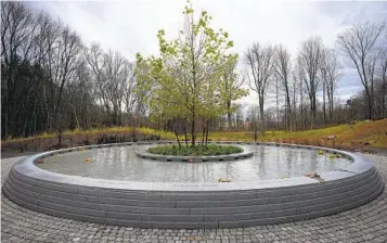  ?? BRYAN WOOLSTON AP ?? The names of the children and educators who were killed at Sandy Hook Elementary line the memorial.