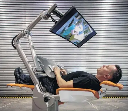  ?? Peter DaSilva For The Times ?? CHE VOIGT, CEO of Altwork, demonstrat­es the reclined position in a preproduct­ion Altwork Station in Geyservill­e, Calif.