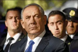  ?? AP 2015 ?? Israeli Prime Minister Benjamin Netanyahu said he won’t resign after police recommende­d corruption charges. “After I read the recommenda­tions report, I can say it is biased, extreme, full of holes like Swiss cheese and doesn’t hold water,” he said...