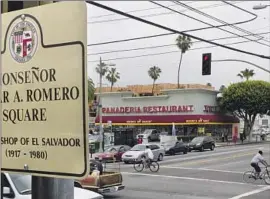  ?? Damian Dovarganes Associated Press ?? A SQUARE at the center of Los Angeles’ Salvadoran community is named for Archbishop Oscar Arnulfo Romero, who was assassinat­ed on March 24, 1980.