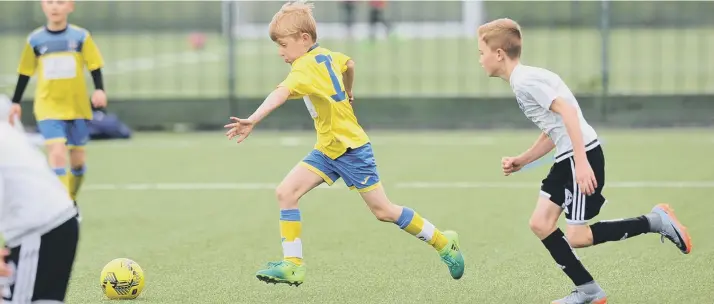  ??  ?? Russell Foster Mini Soccer under 9’s Cup Competitio­n action between Durham City Juniors (yellow) and Silksworth CW Reds, played at Silksworth Sports Complex, Sunderland.