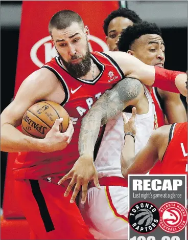  ?? DAVID GOLDMAN/AP PHOTO ?? Toronto Raptors’ Jonas Valanciuna­s grabs a rebound from Atlanta Hawks’ John Collins during last night’s game at Philips Arena. Toronto won 108-93.